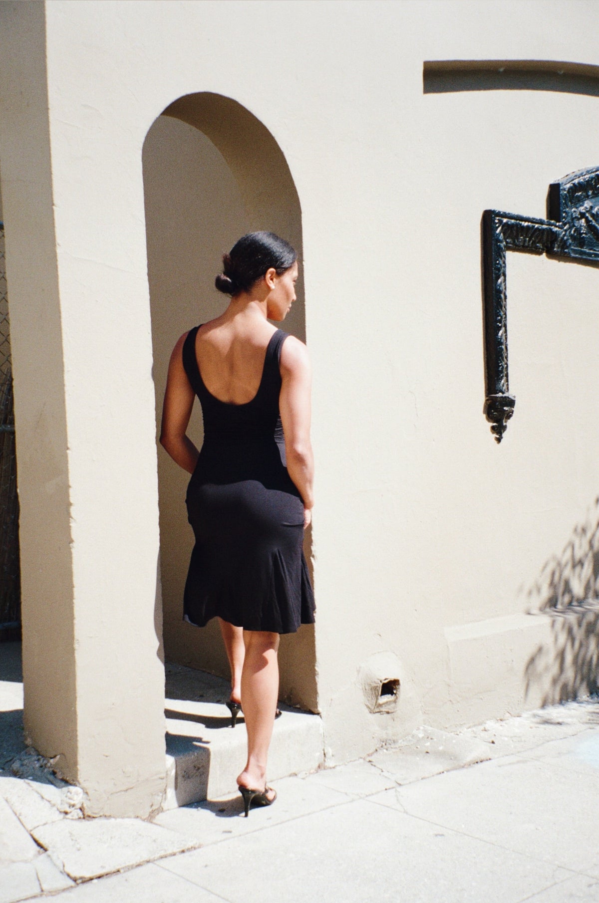 Elara Midi Dress for Women, elegant black, front view. Versatile style, perfect for day or evening.