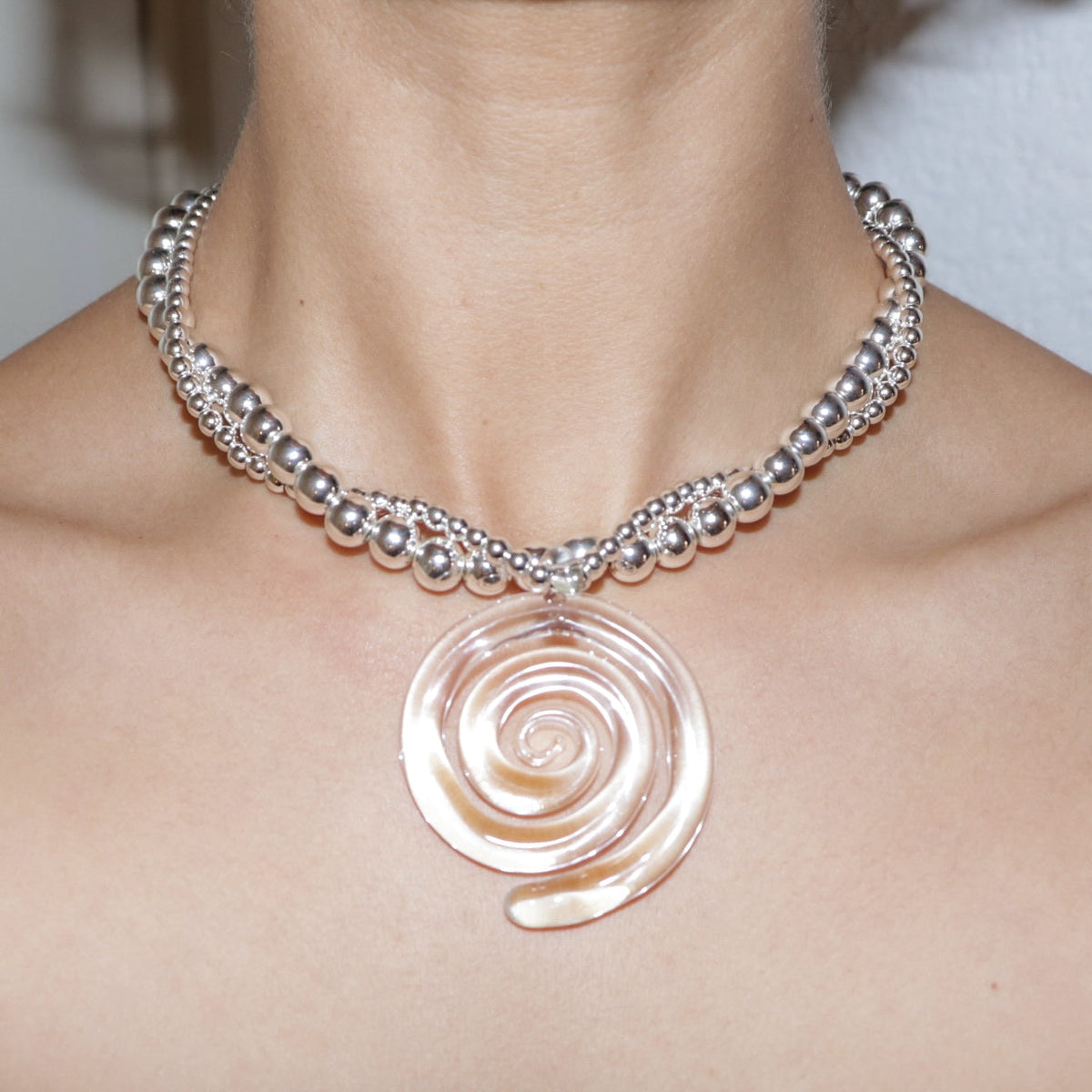 Spiral hoop earrings, chic and modern jewelry, image 3 of 3.